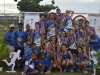 Equipo de Bayamón y entrenadores con sus medallas y trofeos