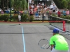 Niños participantes del evento jugando en cancha